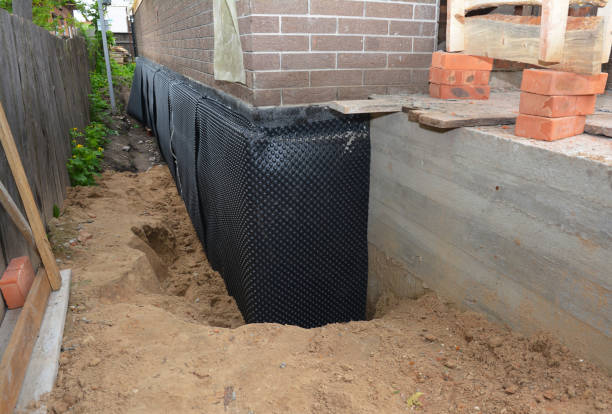 Happy homeowners after waterproofing job in Islip Terrace